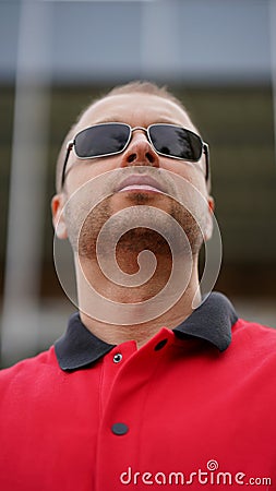 Close-up portrait of man with stubble beard in black glasses Stock Photo