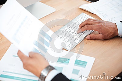 Close-up portrait of men's hands typing on keyboard Stock Photo
