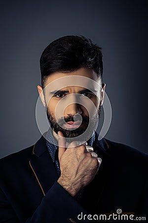 Close up portrait of minded man thinking about smth Stock Photo