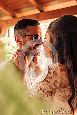 Close up portrait of newlywed couple caressing and kissing on their wedding day. Love concept Stock Photo