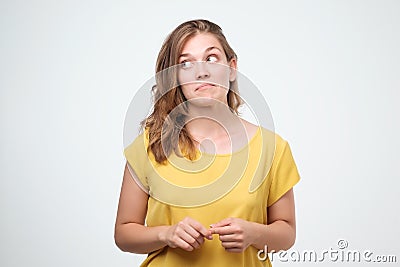 Close up portrait of pretty confident thoughtful girl, holding hand near the face, looking seriously Stock Photo