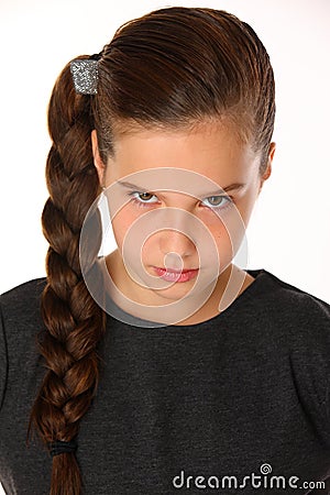 Close-up portrait of pretty young schoolgirl. She is serious and demanding Stock Photo