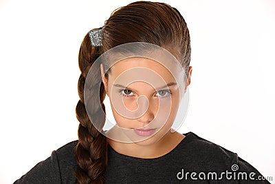 Close-up portrait of pretty young schoolgirl. She is serious and demanding Stock Photo