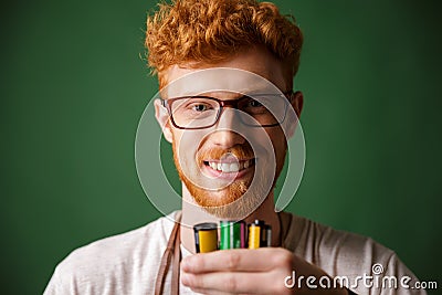 Close-up portrait of readhead bearded photographer in glasses, h Stock Photo