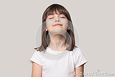 Close up portrait with relax little brown-haired girl. Stock Photo