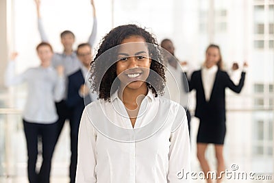 Close up portrait smiling black businesswoman in office. Stock Photo