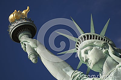 Close-up Portrait of Statue of Liberty Bright Blue Sky Torch Stock Photo
