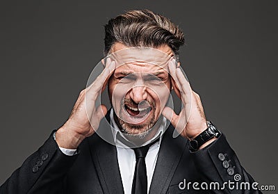 Close up portrait of a stressed mature businessman Stock Photo