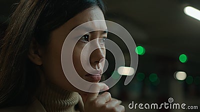 Close up portrait thoughtful pensive Asian chinese woman doubtful girl businesswoman in car lot parking think idea Stock Photo