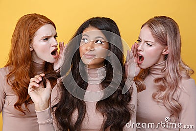 Close up portrait of Two young women screaming on friend Stock Photo