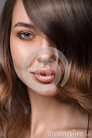 Close-up portrait of a woman. Luxurious hair covers part of her face Stock Photo