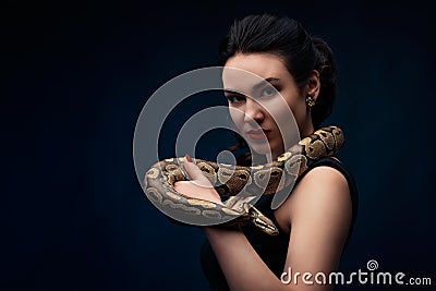 Close up portrait of woman with snake on her neck Stock Photo