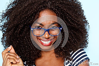 Close up young african american woman with curly hair wearing glasses Stock Photo