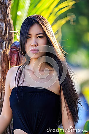 Close-up portrait of young beautiful Asian girl. Looking in the camera Stock Photo