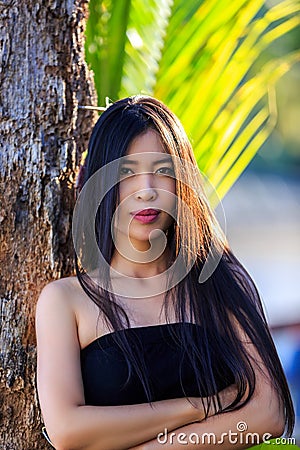 Close-up portrait of young beautiful Asian girl. Looking in the camera Stock Photo