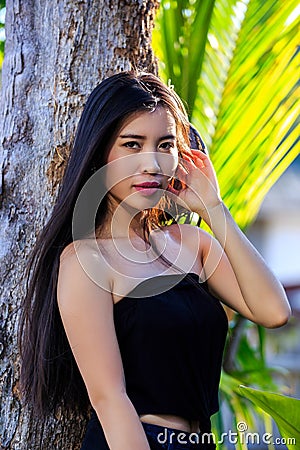 Close-up portrait of young beautiful Asian girl. Looking in the camera Stock Photo