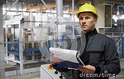 Close-up Portrait of a young worker in a factory Stock Photo