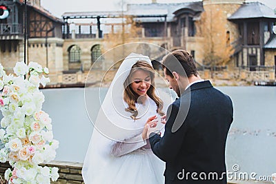 Close-up portraits of stylish newlyweds on the territory of country hotel Stock Photo