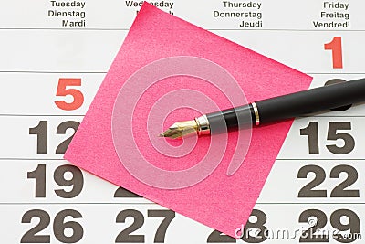 Close up of Post-It Note on Calendar Stock Photo