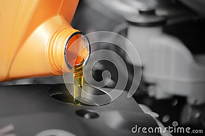 Close up, Pouring motor oil to car engine. Stock Photo