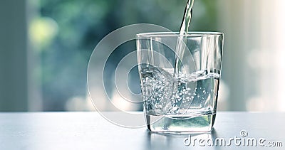 Close up the pouring purified fresh drink water from the bottle Stock Photo