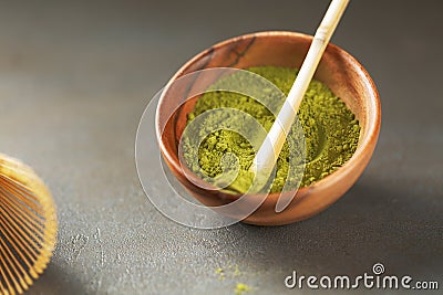 Close up powder of matcha tea is partially dissolved in hot water Stock Photo