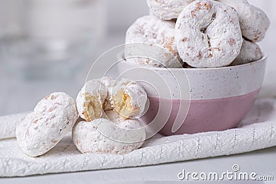 Close up of powdered sugar mini donuts Stock Photo