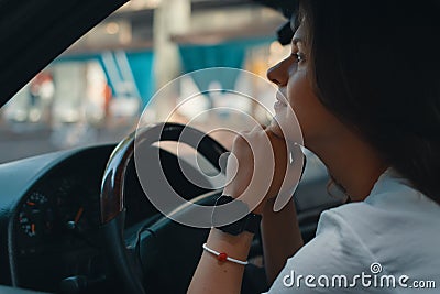 Close-up preety woman portrait holding hands on the steering whe Stock Photo