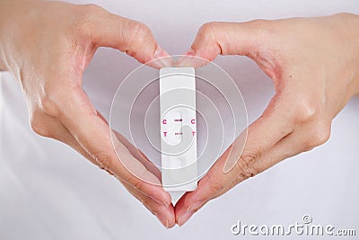 Close up pregnancy test with love women feeling happiness. Stock Photo