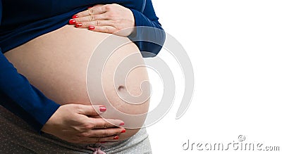 Close-up of pregnant woman grabbing her tummy with copy-space Stock Photo