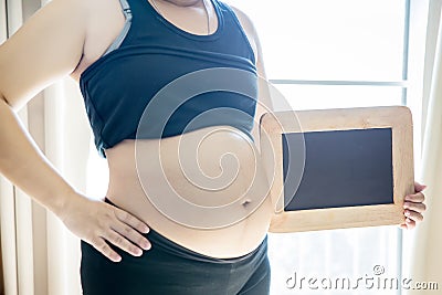 Close up pregnant woman`s belly. prenancy and maternity concept. Stock Photo