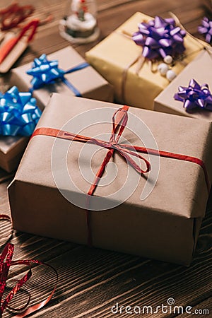 Close up present wrapped in craft paper Stock Photo