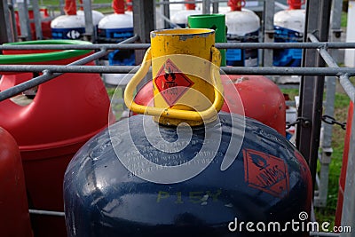 Close-up pressurized gas cylinder in a rack Editorial Stock Photo