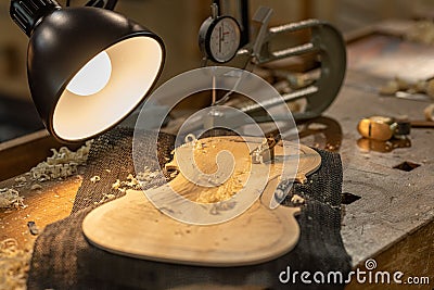 Close-up of a professional master artisan luthier working on the creation of a handmade violin Stock Photo