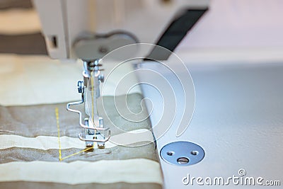 Close up of a professional typewriter for tailoring at a manufacturing plant. Textile: Industrial embroidery machine. Computerized Stock Photo