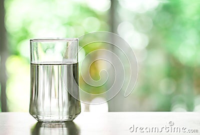 Close up purified fresh drink water from the bottle on table in Stock Photo