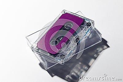 Close up of purple cassette tape and white box on white background Stock Photo