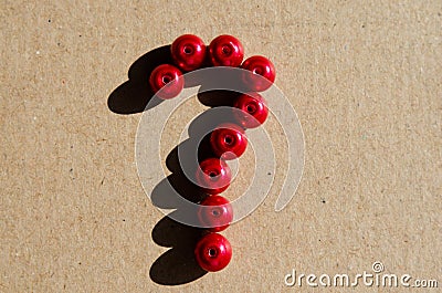 Close-up of question mark sign made of red plastic balls. Concept on unanswered questions Stock Photo