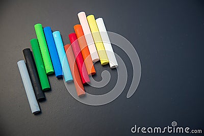Close up rainbow colorful chalks on chalkboard. image for background Stock Photo
