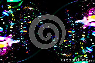 Rainbow soap bubbles on black backgrounds. Stock Photo