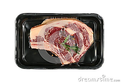 Close up raw beef ribeye steak vacuum sealed Stock Photo