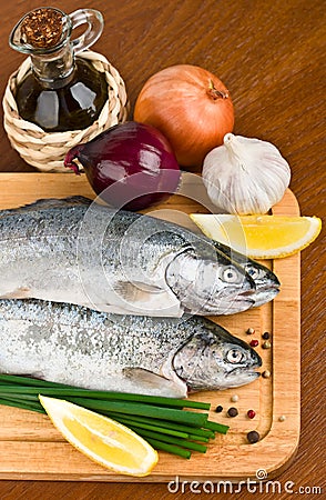 Close-up raw fish trout on a wooden board Stock Photo