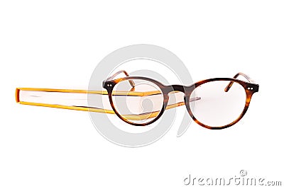 Close-up of reading glasses and close book isolated on white background Stock Photo