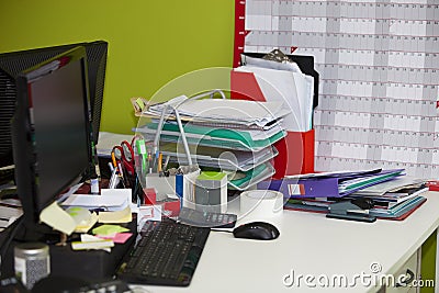 Close-up of real life messy desk in office Stock Photo