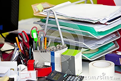 Close-up of real life messy desk in office Stock Photo