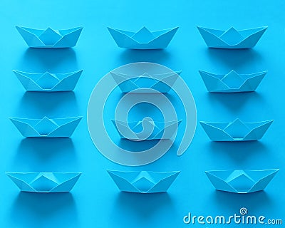 Close Up Real Origami Boats On Blue Background Stock Photo