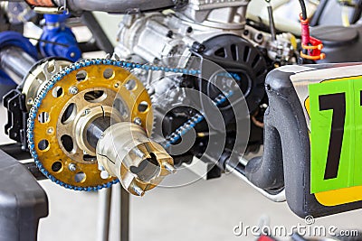 Close up rear wheel hubs with spindle of sport go kart mini racing car during check and maintenance at service station Stock Photo