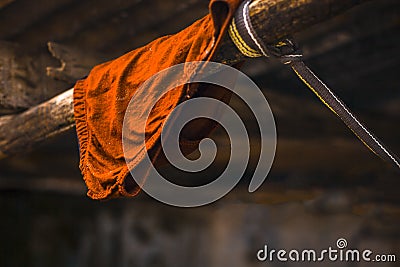 Close up of red colored under wear lying on washing line. Stock Photo