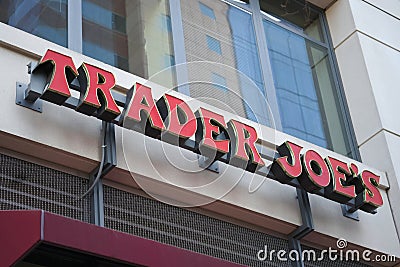 Close-up of red exterior Trader Joe's supermarket sign. Editorial Stock Photo