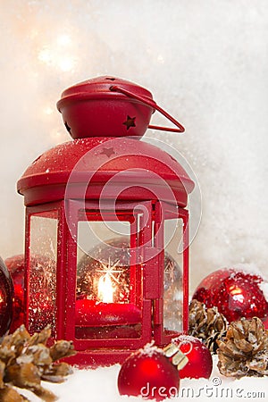 Close up of red lantern with balls and cones for christmas - greeting card first advent Stock Photo